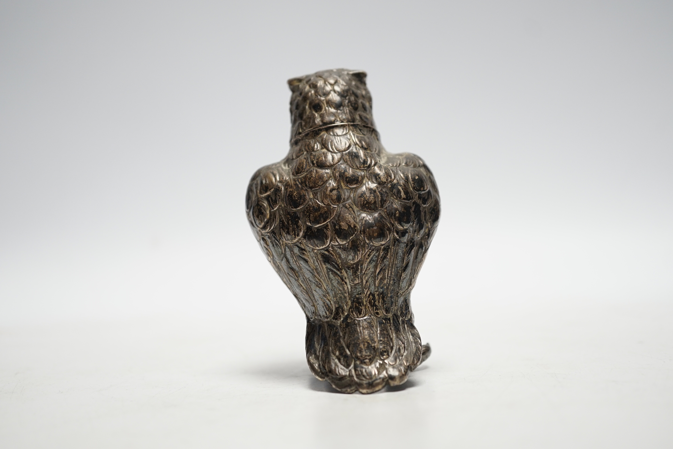 A late 19th/early 20th century novelty silver pepperette, modelled as an owl, import marks for Berthold Muller, London, no date letter, 93mm.